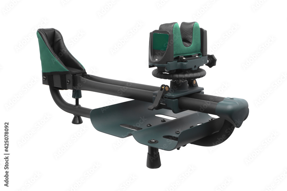 Rig for sighting weapons. Shooting rest for sighting in any rifle or shotgun. Adjustable ambidextrous recoil reducing rifle shooting rest for outdoor range. Isolate on a white back Rig for sighting weapons. Shooting rest for sighting in any rifle or shotgun. Adjustable ambidextrous recoil reducing rifle shooting rest for outdoor range. Isolate on a white back