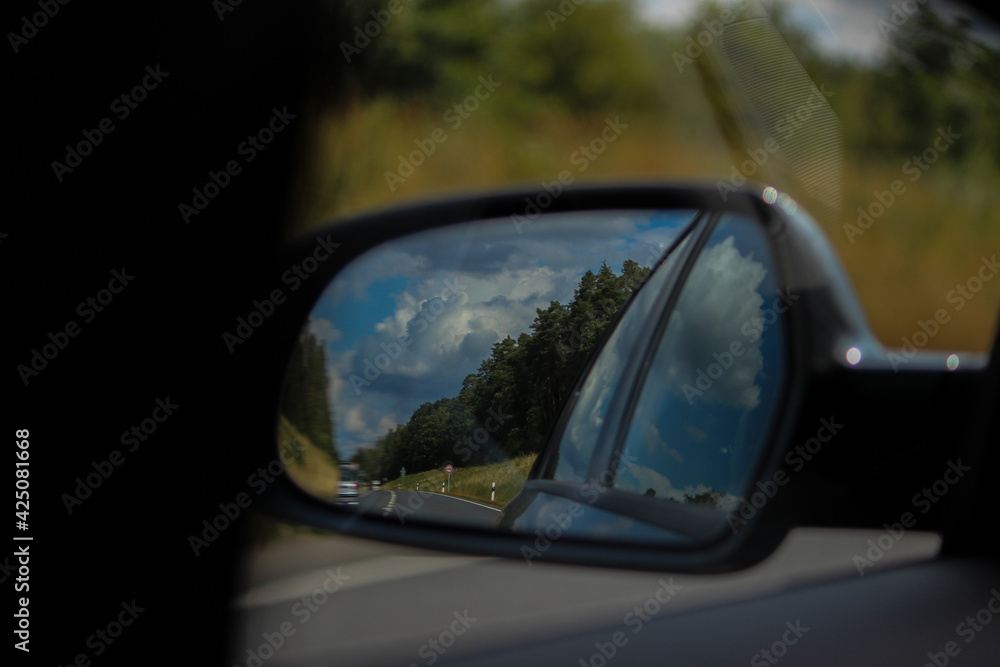 driving on a road , The cloud in the mirror 