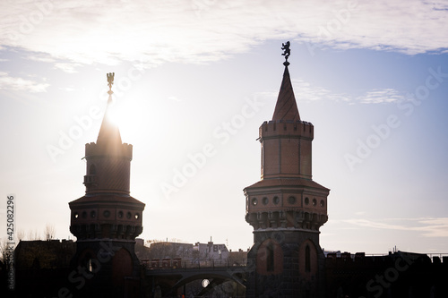 silhouette of oberbaum bridge in berlin during sunset photo