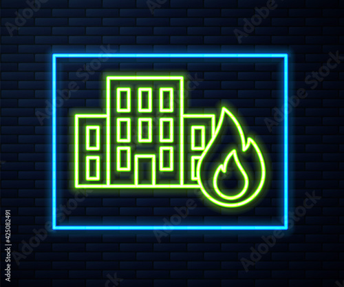 Glowing neon line Fire in burning buildings on city street icon isolated on brick wall background. Destroyed city on fire. Vector