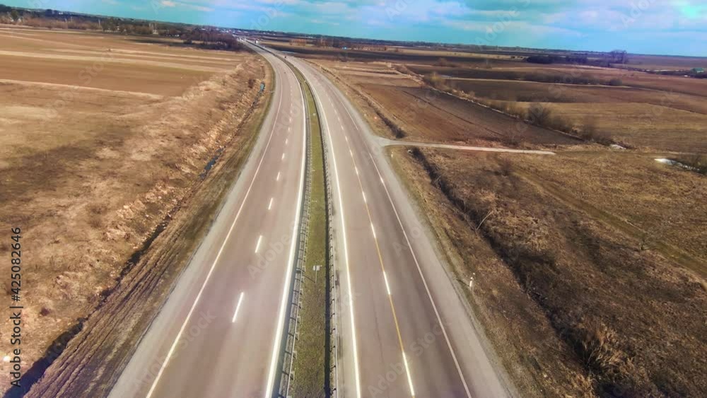 Aerial drone view cars road near field. Copter shot. Forest, country, natural, flight, journey, trees, travel, above, field, environment, nature, fly, outdoor. Slow motion Aerial drone view cars road near field. Copter shot. Forest, country, natural, flight, journey, trees, travel, above, field, environment, nature, fly, outdoor. Slow motion