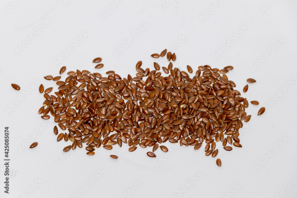 Closeup of flaxseed on a white background. Macro shot of flax seed