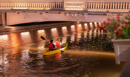 A tourist rowing a boat in Ong Ang Canal, new walking street in bangkok city. photo