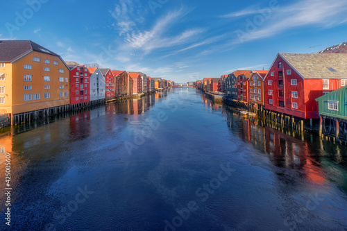 Colourful houses with reflection by the river in Trondheim, Norway