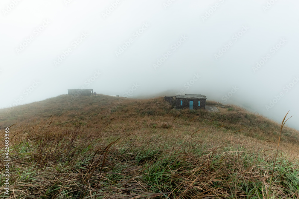 Epic Misty Morning Landscape of Sunset Peak on Lantau Island, Hong Kong Epic Misty Morning Landscape of Sunset Peak on Lantau Island, Hong Kong