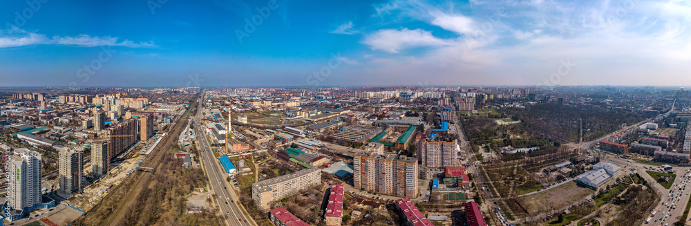 urban aerial landscape on a sunny day - industrial area with old abandoned factories on the northern outskirts of Krasnodar city near the railway and highway
