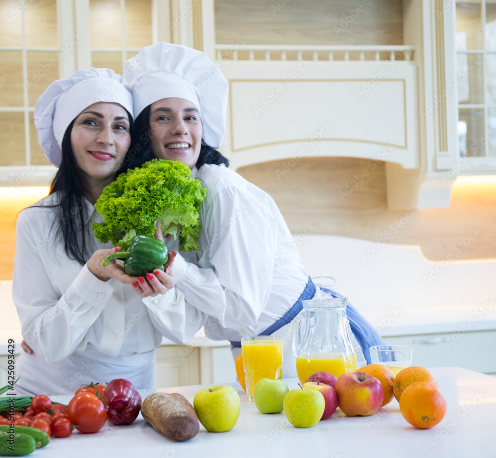 family cooking together. Happy day. Kitchen. Vegetables. family cooking together. Happy day. Kitchen. Vegetables.