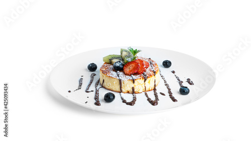 Cheesecake with chocolate and fruit isolated on a white background.