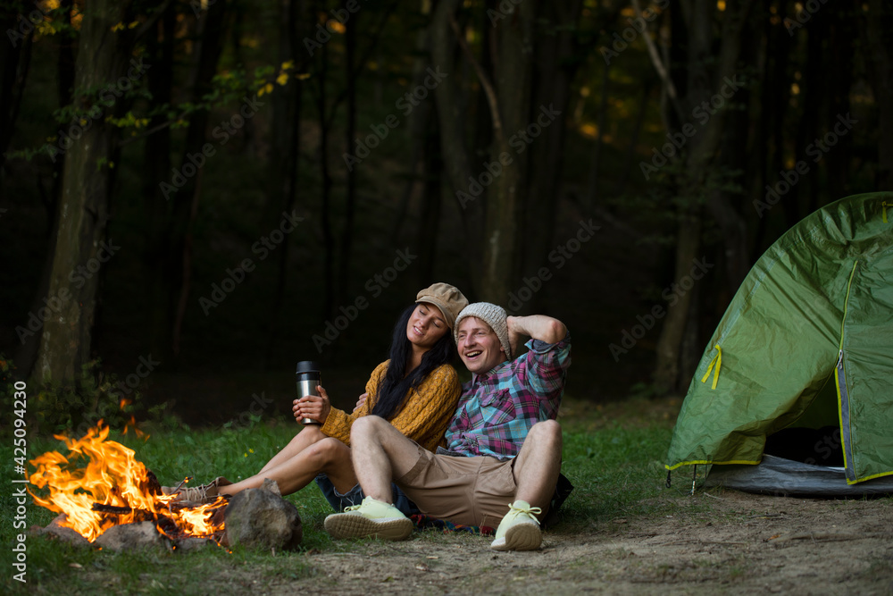 Shot of a happy couple camping on the nature. Couple in love. Camping. Shot of a happy couple camping on the nature. Couple in love. Camping.