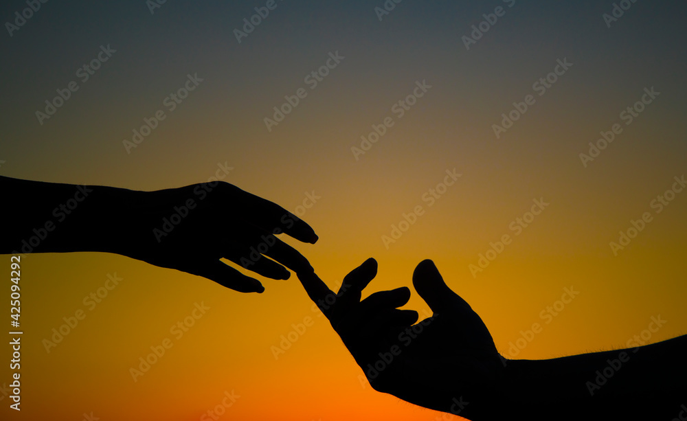 silhouette of hands. Couple in love. Sensual. Man and woman hand. Photo. Sunset.