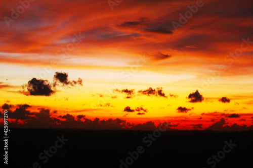 JENEPONTO INDONESIA, March 23, 2021: the sky begins to change color when the sun sets and the clouds take on various forms photo