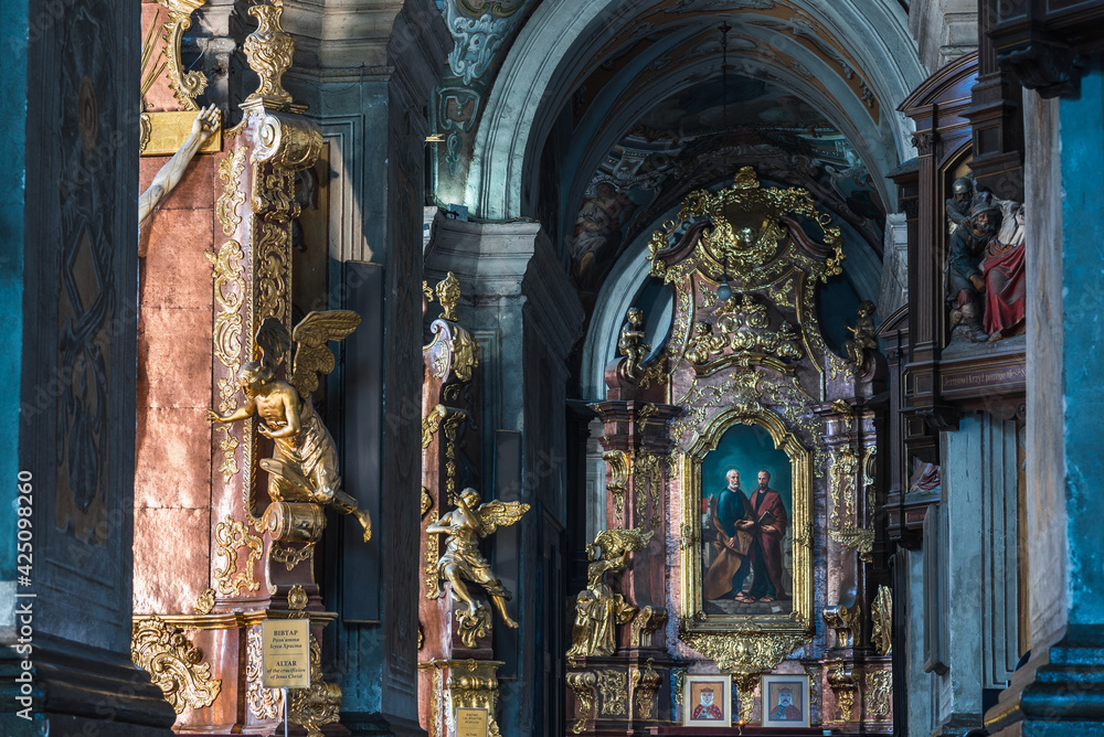 LVIV, UKRAINE - April, 2021: Saints Peter and Paul Garrison Church. Altar of the Apostles Peter and Paul.