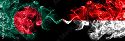 Bangladesh, Bangladeshi vs Indonesia, Indonesian smoky mystic flags placed side by side. Thick colored silky abstract smokes flags.
