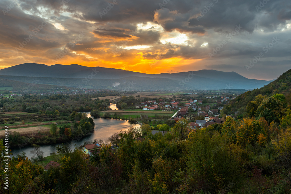 Fototapeta premium sunrise over the mountains and river