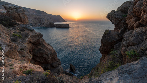 Cliff landscape at sunrise on the tropical coast of Granada, next to the Rijana beach.