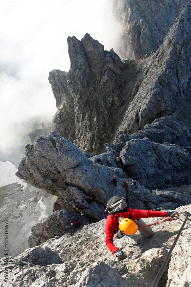 Climbing alpinist on Koenigsjodler route, Austria