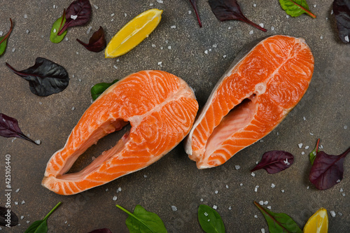 Raw salmon fish steas on table