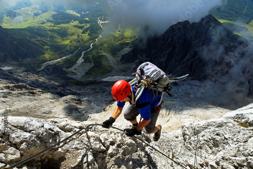 Alpinist climbing on Koenigsjodler Ridge, Austrian Alps, Europe