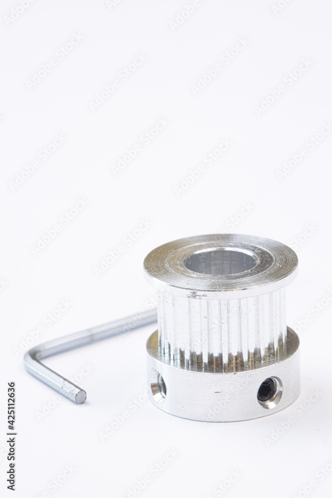 Aluminum pulley for cnc machines above white background Aluminum pulley for cnc machines above white background