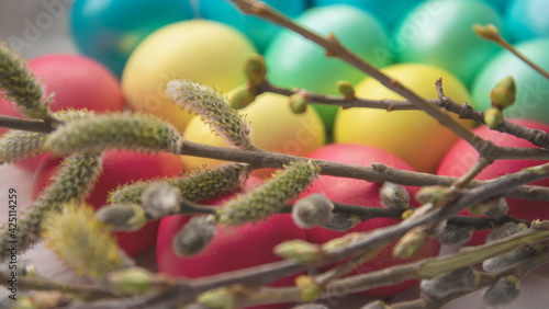 Easter eggs and blossoming branches on a light background. close-up