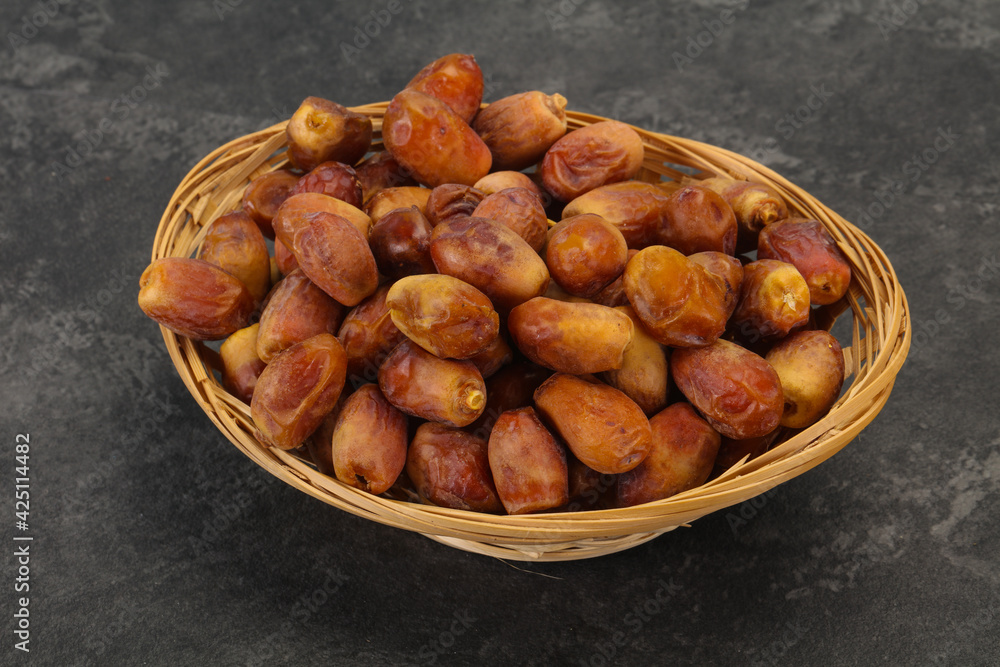 Sweet tasty dry dates in the basket Sweet tasty dry dates in the basket