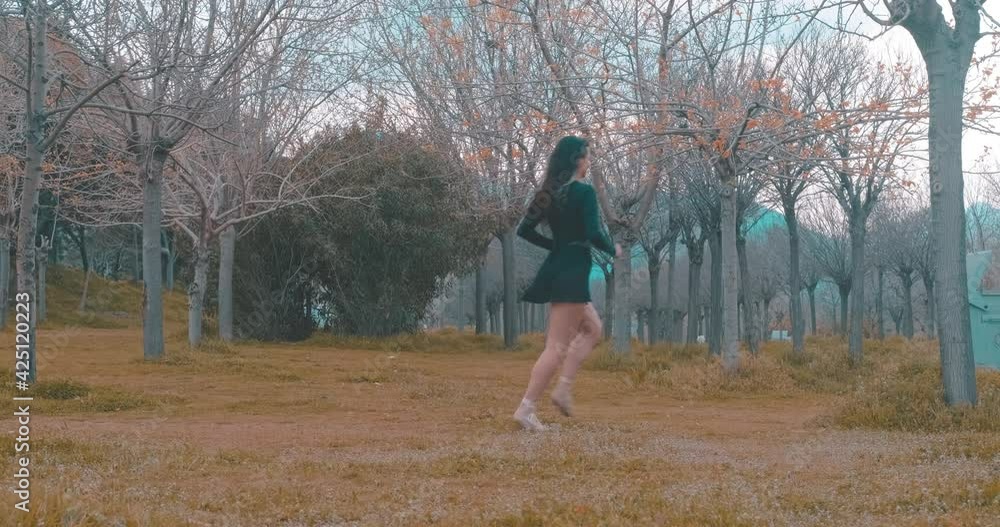 Young fit woman is training in autumn, park. Workout time, sportive jogger athlette is running. Young fit woman is training in autumn, park. Workout time, sportive jogger athlette is running.