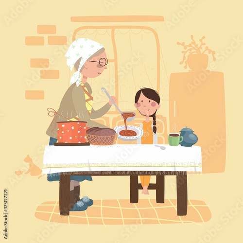 grandmother gives food to her granddaughter. girl is sitting on a chair. they are in the kitchen.