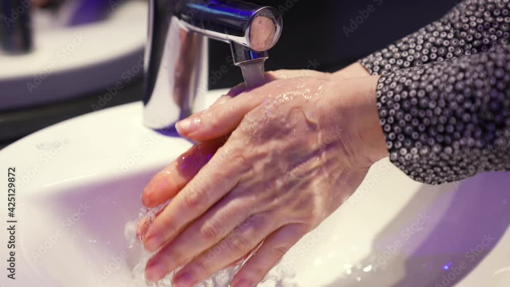 Prevention of coronavirus pandemic. Washing hands with soap. Prevention protection against infection. Washing hands with soap in bathroom. Protection against coronavirus pandemic. Personal hygiene. Prevention of coronavirus pandemic. Washing hands with soap. Prevention protection against infection. Washing hands with soap in bathroom. Protection against coronavirus pandemic. Personal hygiene.