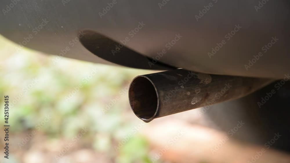 Close up of an exhaust pipe during engine start. Close up of an exhaust pipe during engine start.