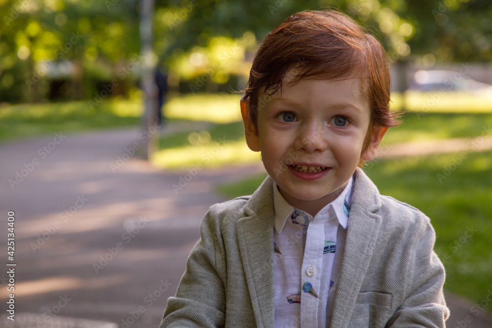 Cute, Redhead, Smiling Boy in a Park Cute, Redhead, Smiling Boy in a Park