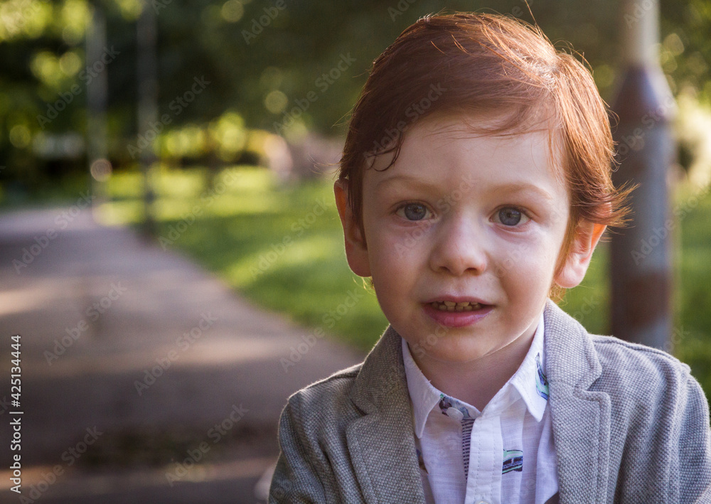 Cute, Redhead, Smiling Boy in a Park Cute, Redhead, Smiling Boy in a Park