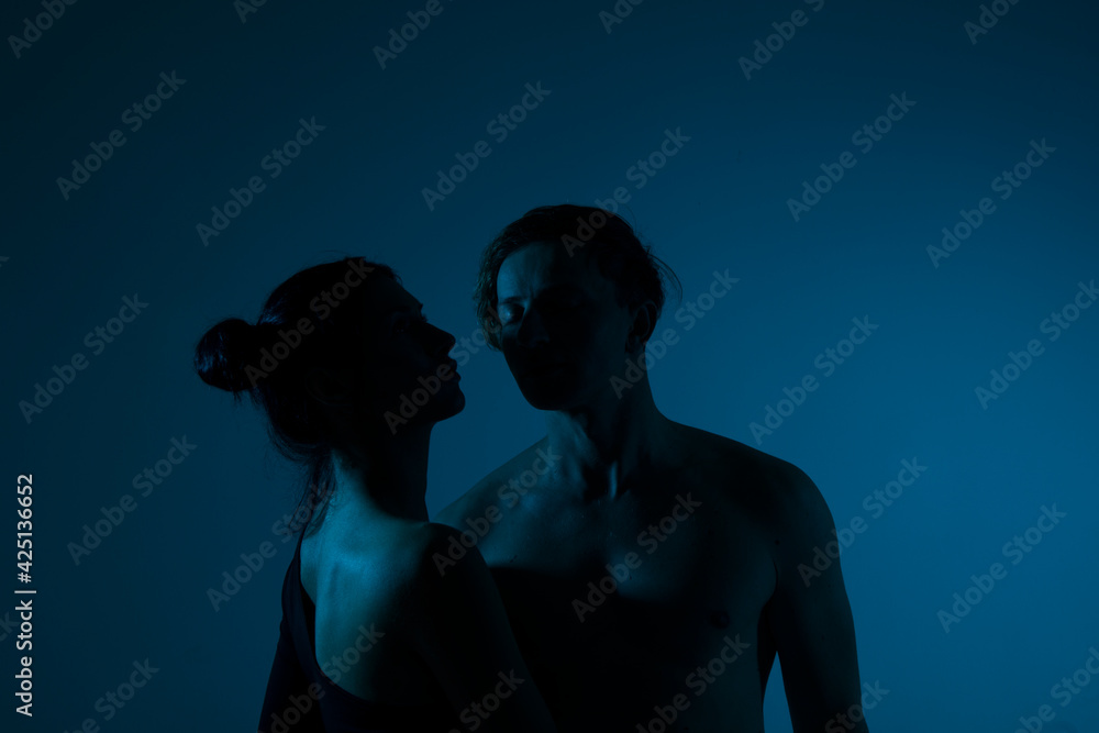 silhouette of a couple. Erotica couple. Neon light. Photo. 
