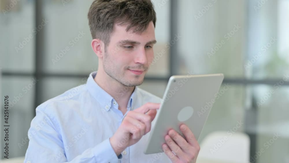 Portrait of Young Man using Digital Tablet Portrait of Young Man using Digital Tablet