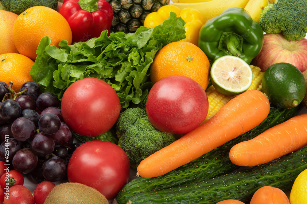 Assorted fresh ripe fruits and vegetables. Food concept background. Assorted fresh ripe fruits and vegetables. Food concept background.