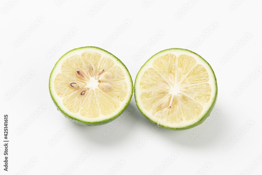 Juicy slice of lime isolated on white background Juicy slice of lime isolated on white background