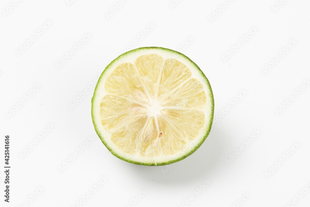Juicy slice of lime isolated on white background Juicy slice of lime isolated on white background