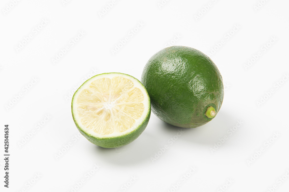 Juicy slice of lime isolated on white background Juicy slice of lime isolated on white background