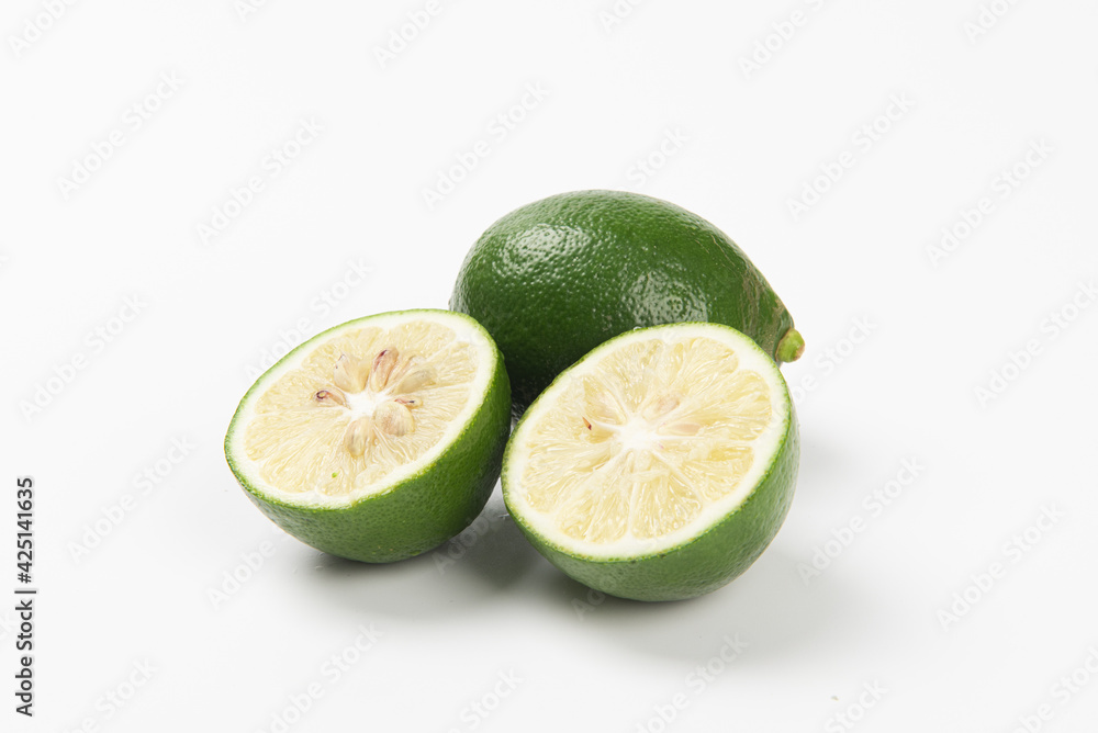 Juicy slice of lime isolated on white background Juicy slice of lime isolated on white background