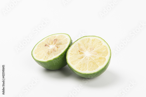 Juicy slice of lime isolated on white background
