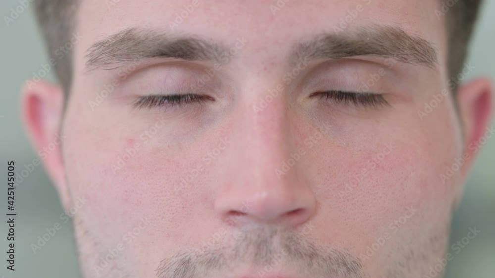 Close up of Blinking Eyes of Attractive Young Man Close up of Blinking Eyes of Attractive Young Man