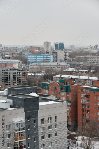 View from above of the houses of Sibirskiy Trakt street in Kazan City. Early spring. Cloudy weather. Selective Focus photo