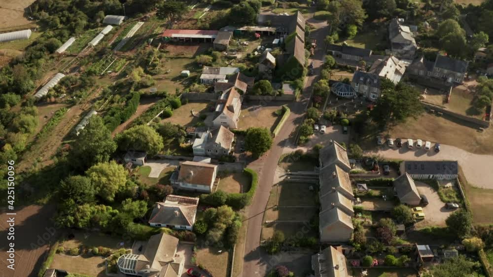 Overhead aerial of prosperous countryside village houses and gardens in Dorset, England Overhead aerial of prosperous countryside village houses and gardens in Dorset, England