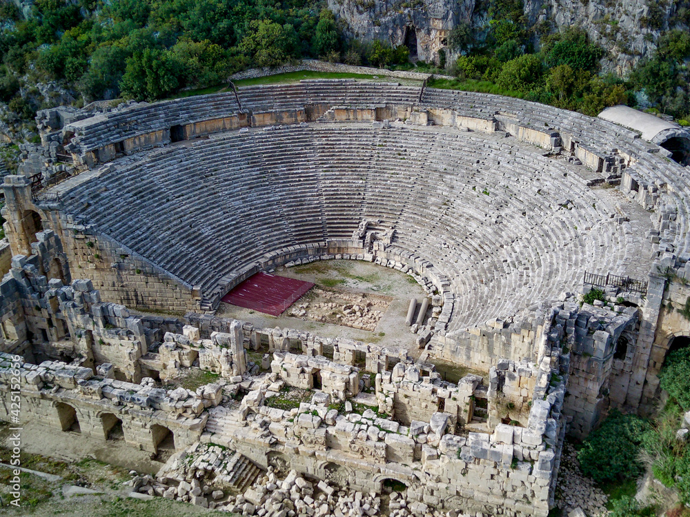 High angle drone aerial view of ancient greek rock cut lykian empire amphitheatre and tombs in Myra (Demre, Turkey)