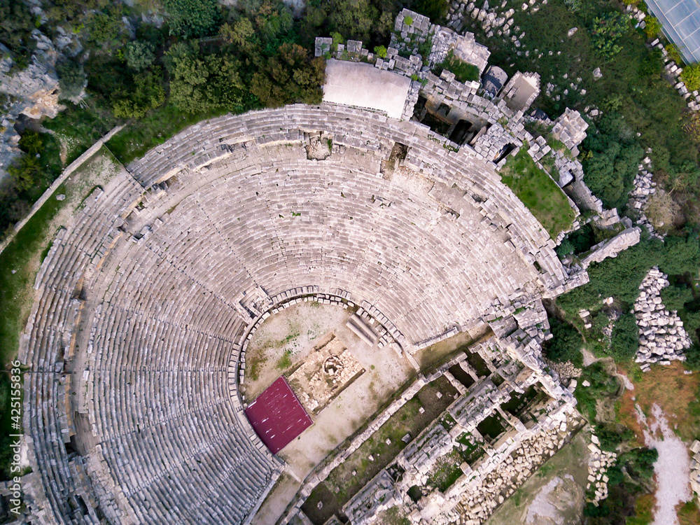High angle drone aerial view of ancient greek rock cut lykian empire amphitheatre and tombs in Myra (Demre, Turkey)
