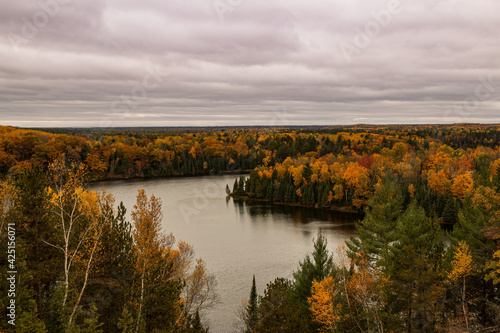 Cloudy Highbanks View During Autumn Over The Ausable River Cooke Dam Pond