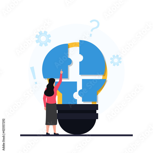 Women put piece of puzzle on the bulb metaphor of problem solving.