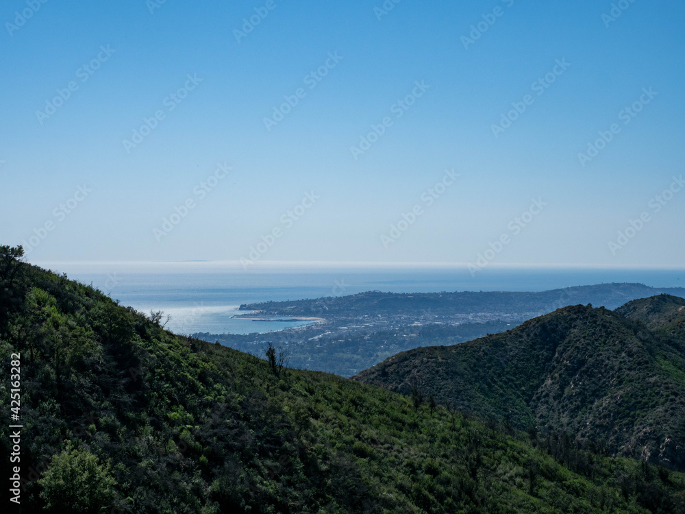 Panoramic view of Montecito, Pacific Ocean and Channel Islands from Old Romero Canyon Trail in Montecito, California near Santa Barbara  on a clear, sunny spring day