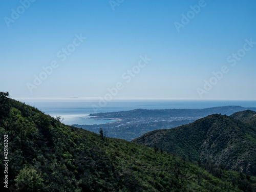 Panoramic view of Montecito, Pacific Ocean and Channel Islands from Old Romero Canyon Trail in Montecito, California near Santa Barbara on a clear, sunny spring day