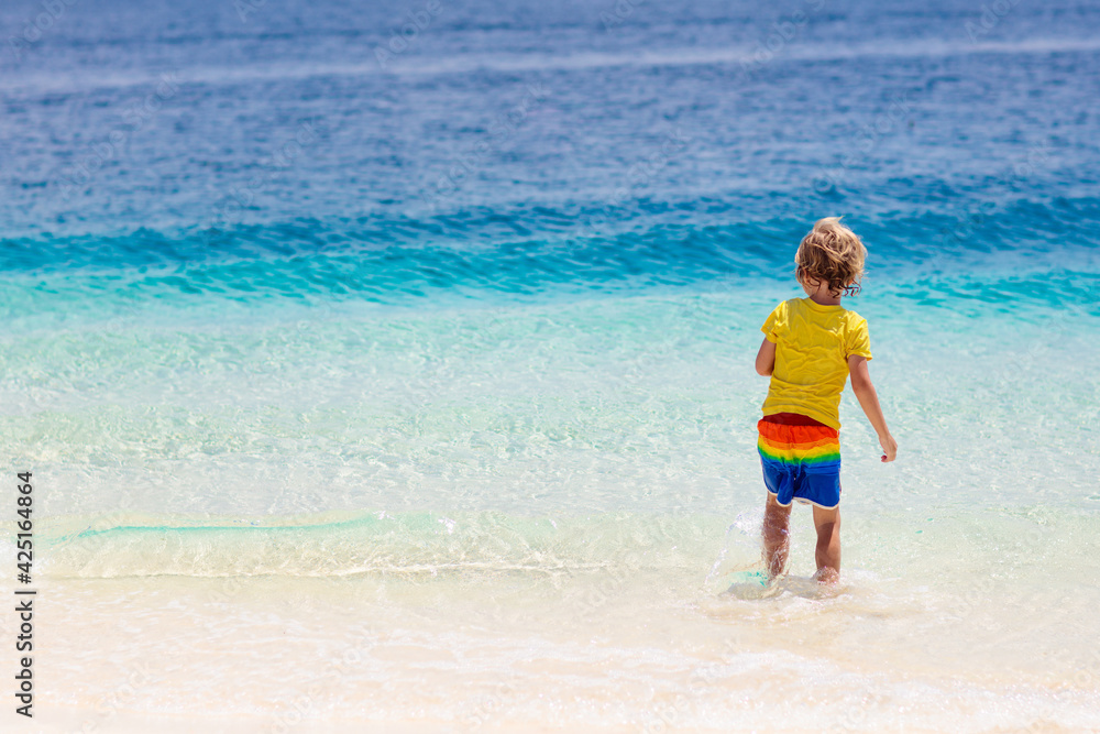 Kids playing on beach. Children play at sea. Kids playing on beach. Children play at sea.