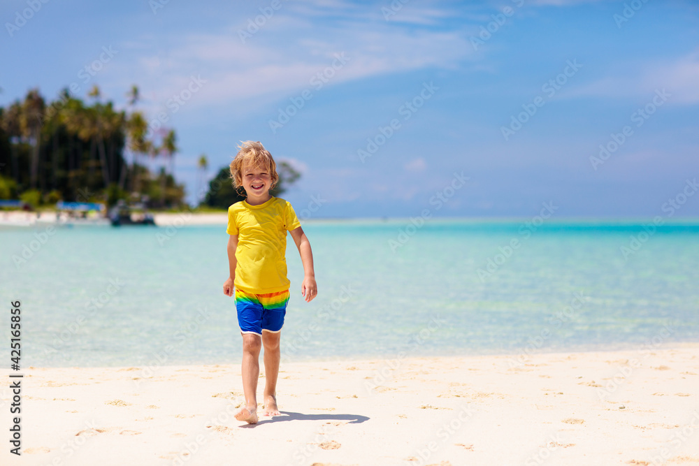 Kids playing on beach. Children play at sea.